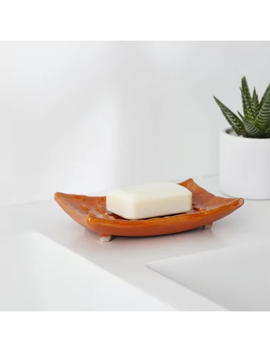 Seifenschale Ton rechteckig orange hinter Lavabo mit Pflanze