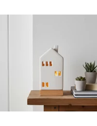 Lichthaus - Teelicht Haus - Dekoration Weihnachten - weiss-glänzend - 22,5 cm auf Ablage neben Büchern beleuchtet