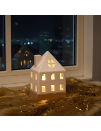 Lichthaus - Teelicht Haus - Dekoration Weihnachten - weiss-glänzend - 17.7 cm vor Fenster auf Sims im dunkeln